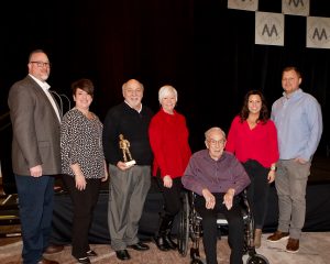 Ted Powell accepts the 2019 IMAA Miner of the Year Award with his family.
