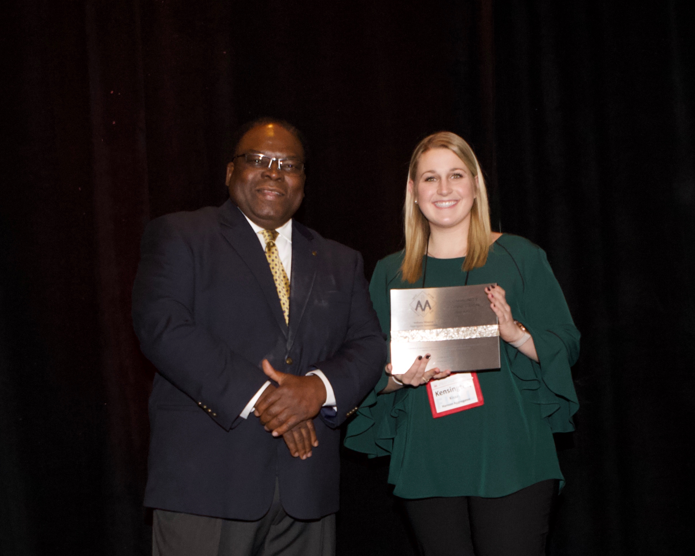 Kensington Kissel accepts the IMAA Community Connection on behalf of Lehigh Hanson Ardmore Quarry.