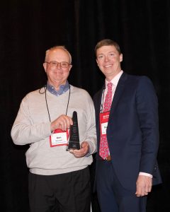 Nathan Wanstrath presents IMAA Hall of Fame Award to his father Ken Wanstrath.