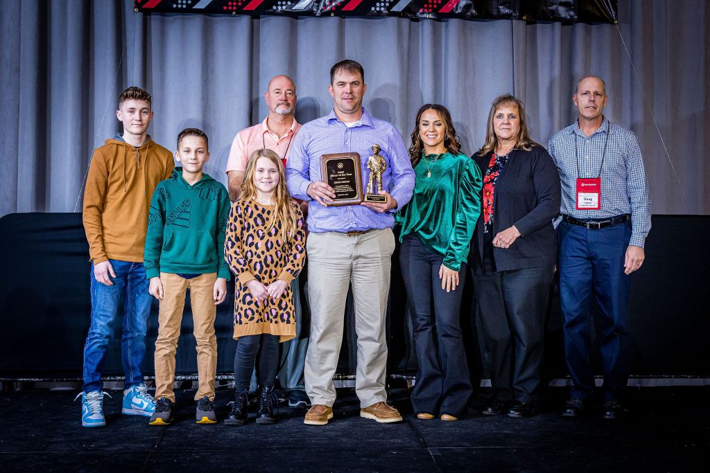 Craig Gibson (center) with his family receiving the 2022 IMAA Miner of the Year award.